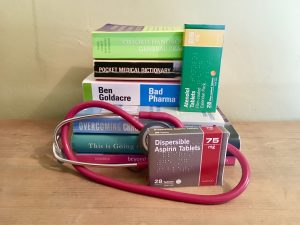 photo of medical books and tablets